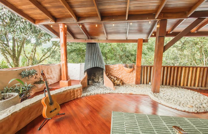 Outdoor fireplace lounge with hardwood floors