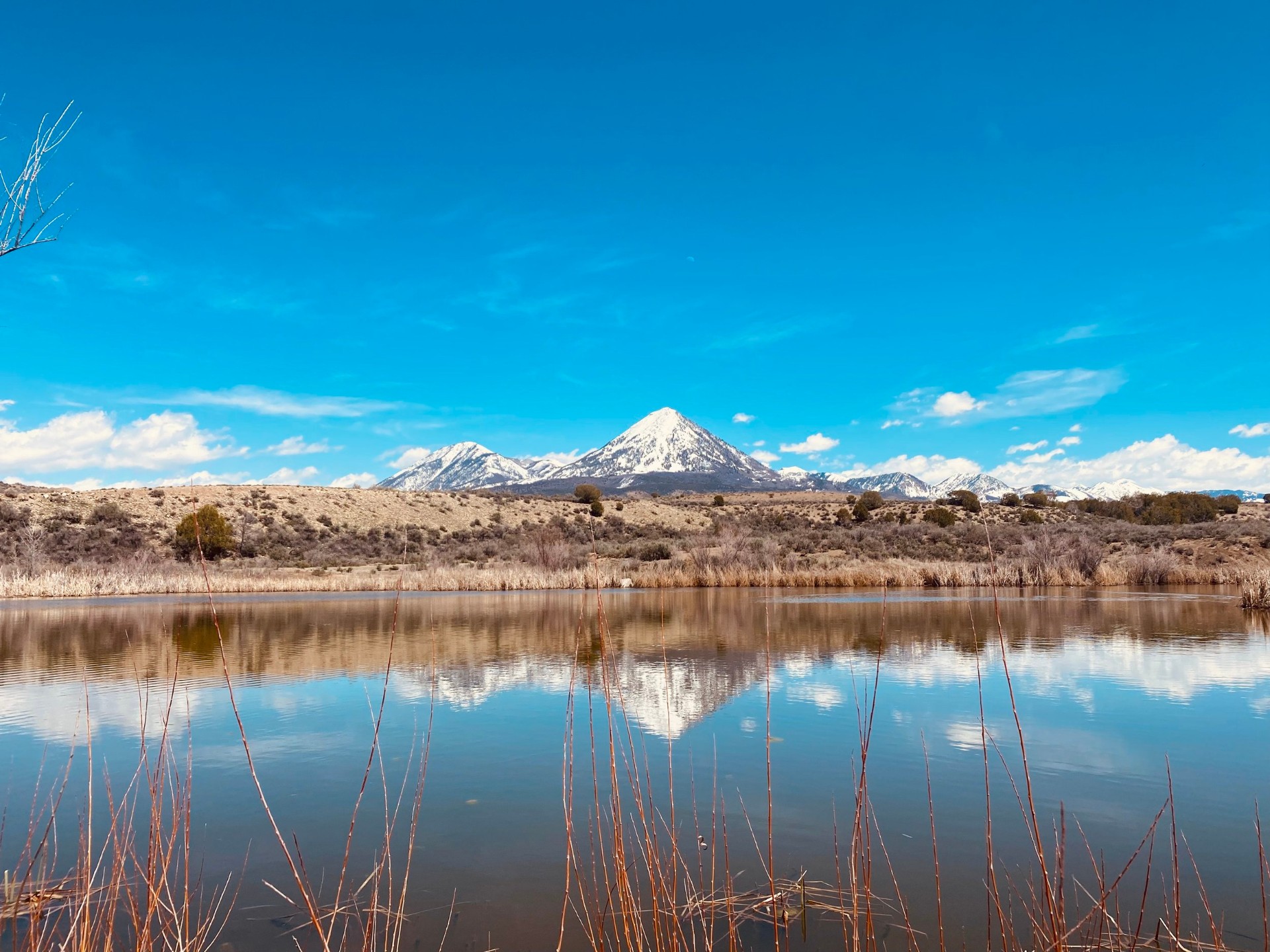 Serene lake and mountain reflections at retreat site